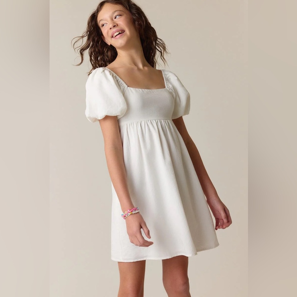 Francesca’s white youth puff sleeve dress with bow back
